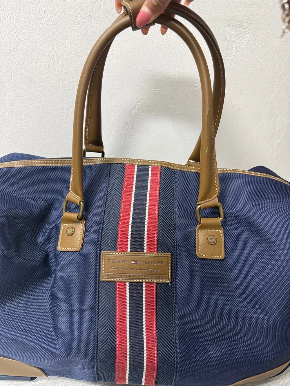 Tommy Hilfiger Navy rolling Duffel with Red & White Center Stripe  carry on